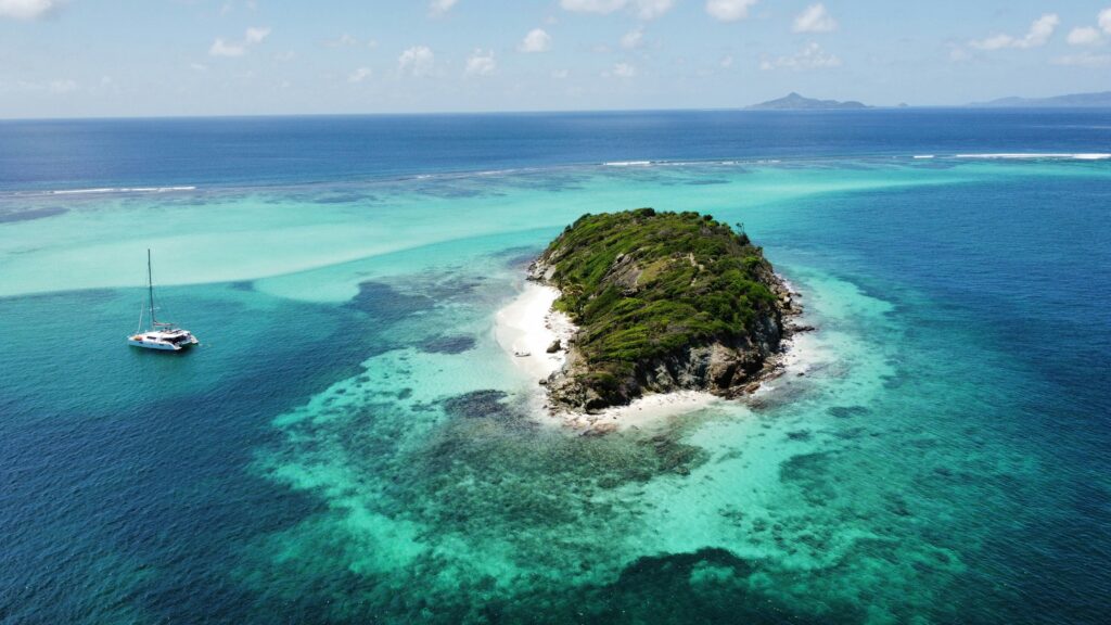 Aerial view of Jamesby island and turquoise waters in Tobago Cays