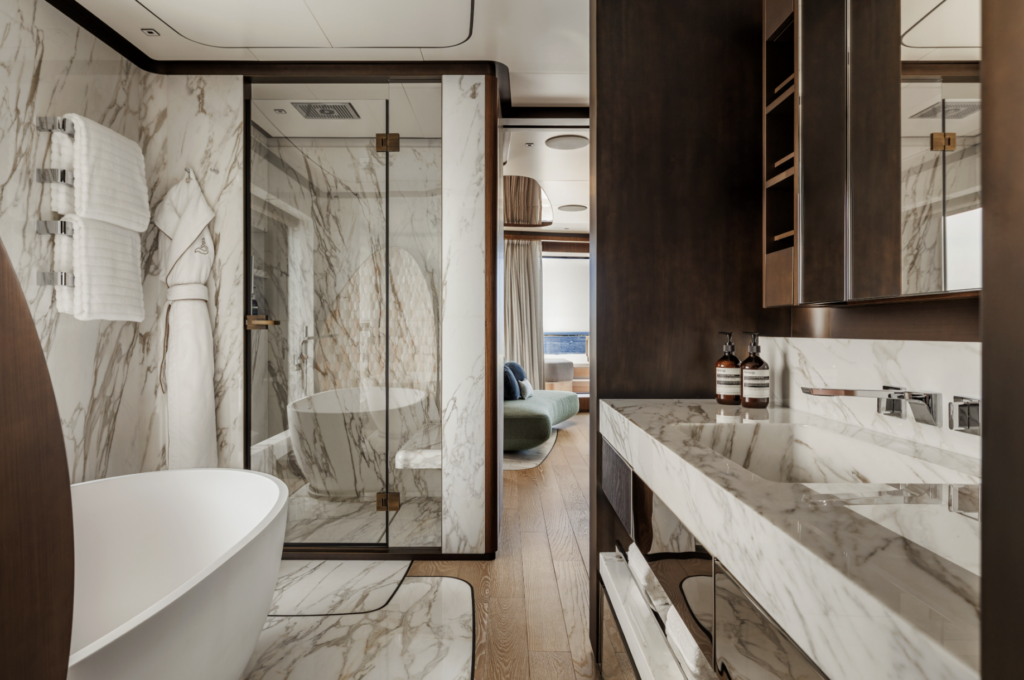 Master bathroom aboard SILVER FOX yacht with marble finishes and bathtub