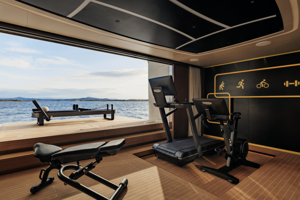 Sea-level gym aboard SILVER FOX yacht with Technogym equipment and ocean views